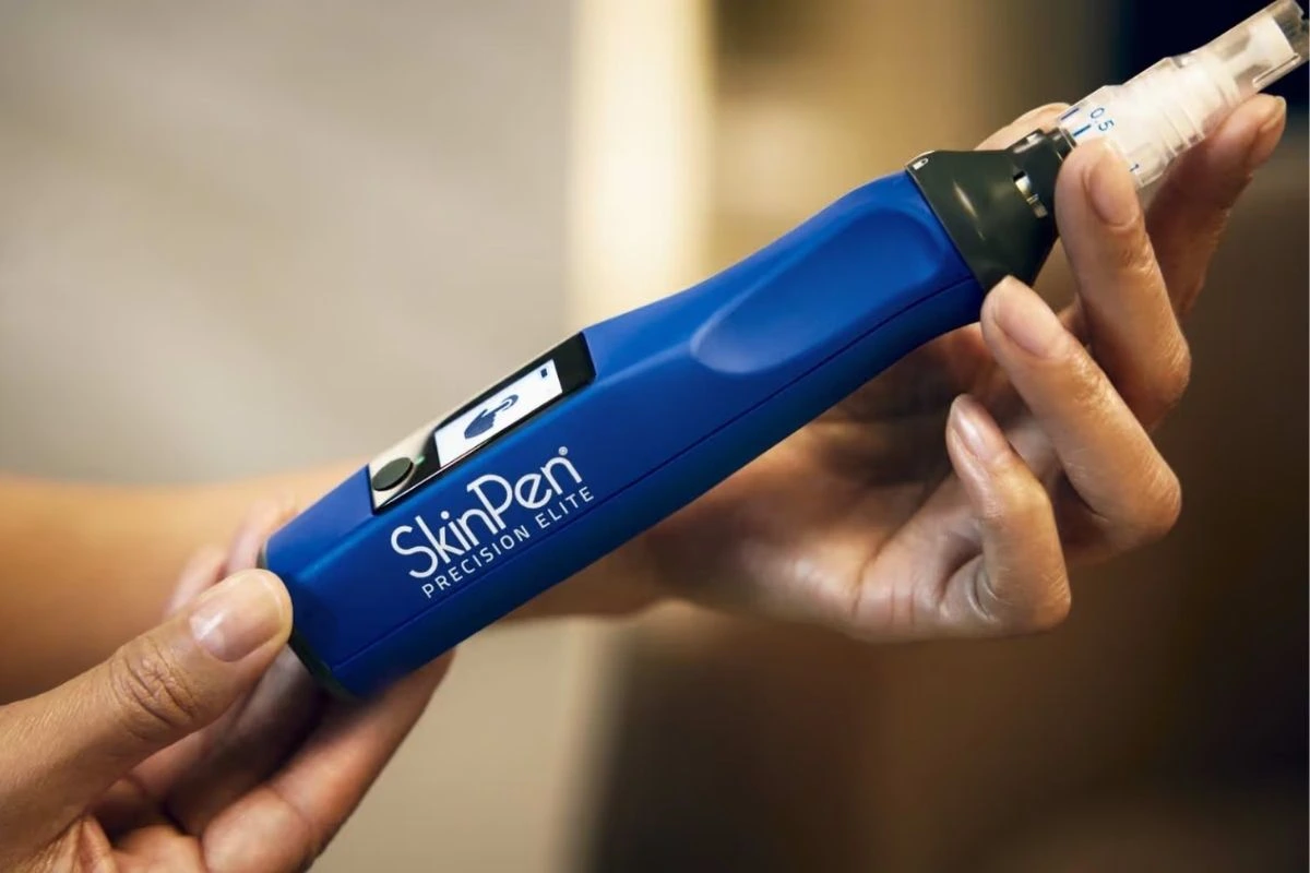 Woman holding the new SkinPen Elite Device