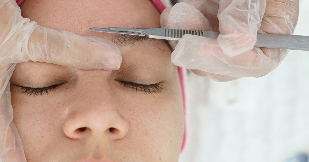 Woman having a dermaplane treatment